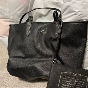 Coach reversible tote in black and camo.